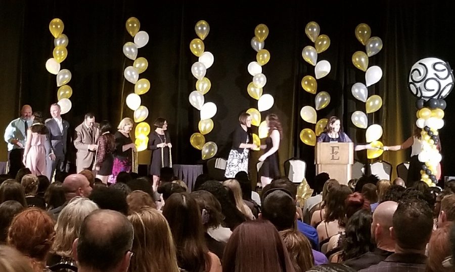 OCSA seniors being awarded their cords on stage. 