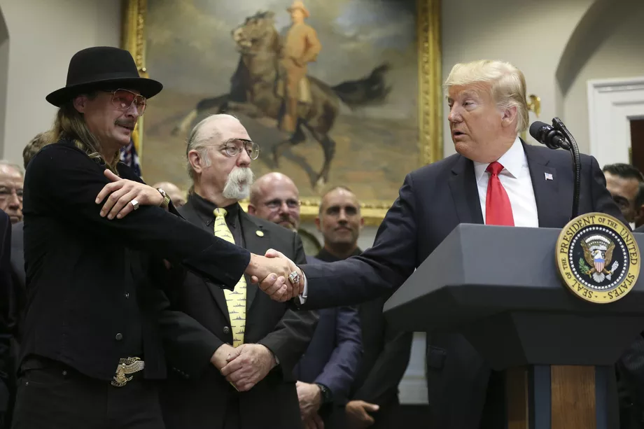 Donald Trump shares a handshake with Kid Rock prior to signing the Music Modernization Act on October 11, 2018. Oliver Contreras-Pool/Getty Images