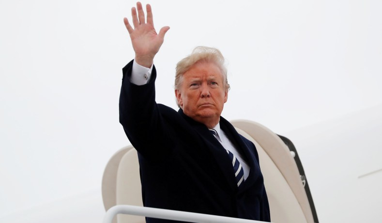 FILE PHOTO: U.S. President Donald Trump waves while boarding Air Force One prior to departing Washington on a campaign trip to Missouri at Joint Base Andrews, Maryland, U.S., November 1, 2018. REUTERS/Carlos Barria/File Photo - RC125DEA6A90