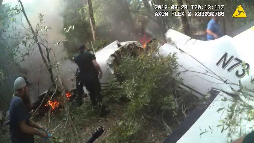 Volusia+County+deputies+and+locals+examine+the+remains+of+the+Cessna+plane+that+went+down+Sunday+evening.