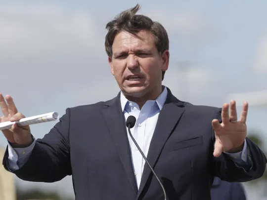 Governor Ron Desantis speaking at a drive through Coronavirus testing location.