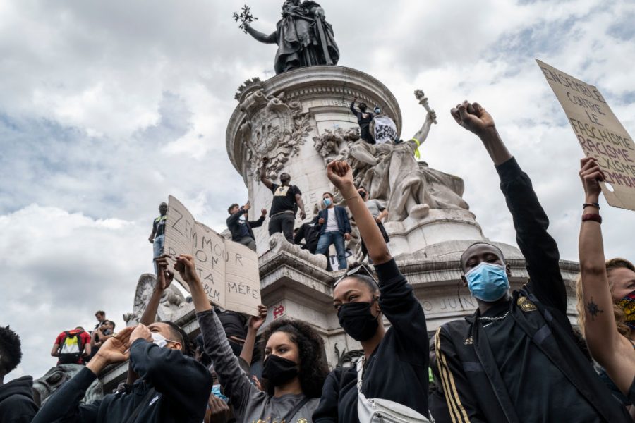  Protesters stand on the monument in Place de la Republique. 