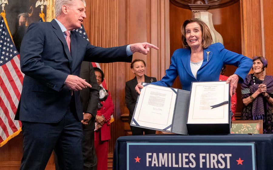 Nancy+Pelosi+holds+up+new+bill.