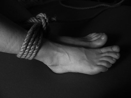 Feet that are tied up.