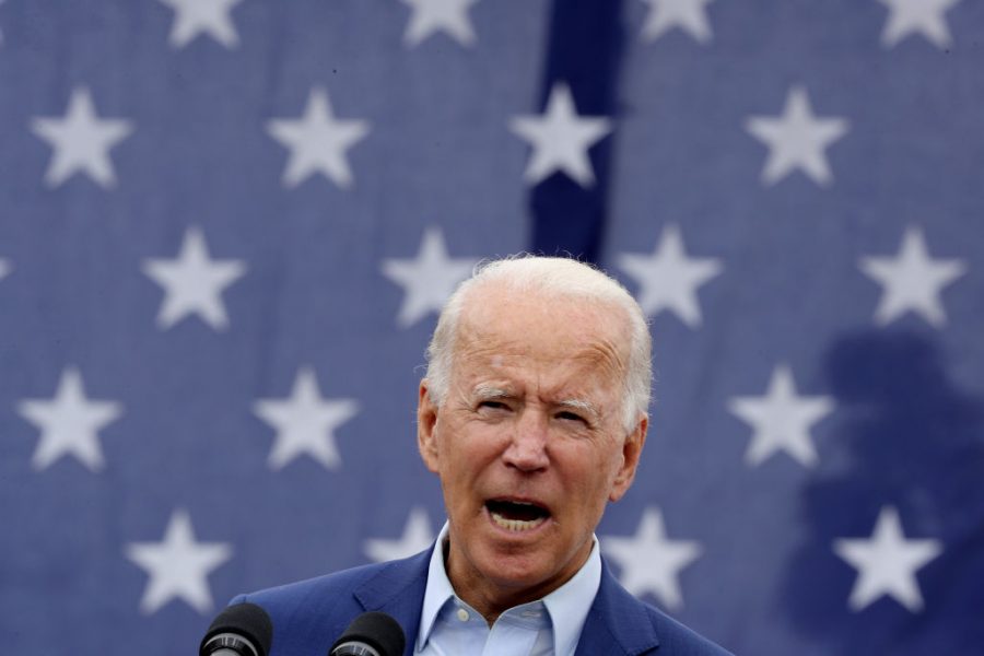 President Joe Biden delivers promises in the parking lot outside the United Auto Workers Region 1 offices in Warren, Michigan.