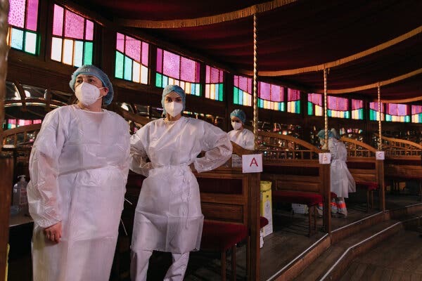 Medical workers about to distribute vaccines.