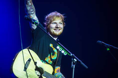 Ed Sheeran performing at a live concert at Forest Nation Bruxelles.