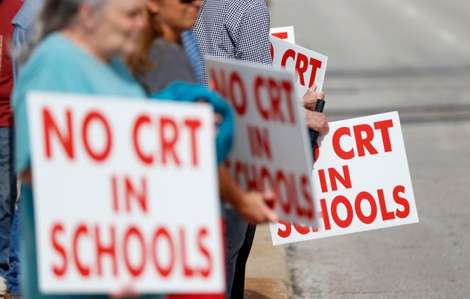 People protesting against CRT in schools.