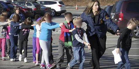 Sandy Hook students flee from the building the day of the shooting.