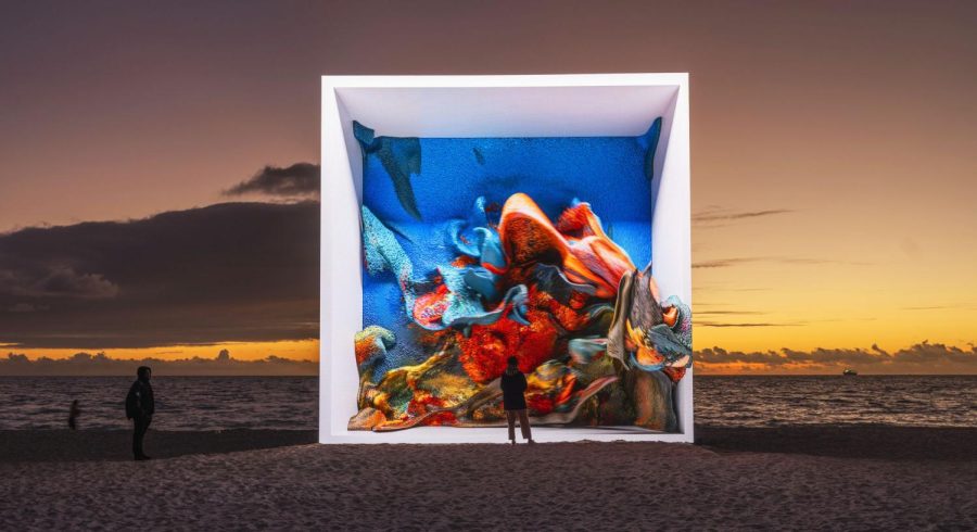 Screen on Miami beach showing artwork of coral