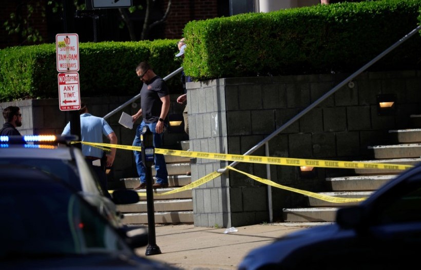 Police deploy at the scene of a mass shooting outside an Old National Bank in Louisville KY.