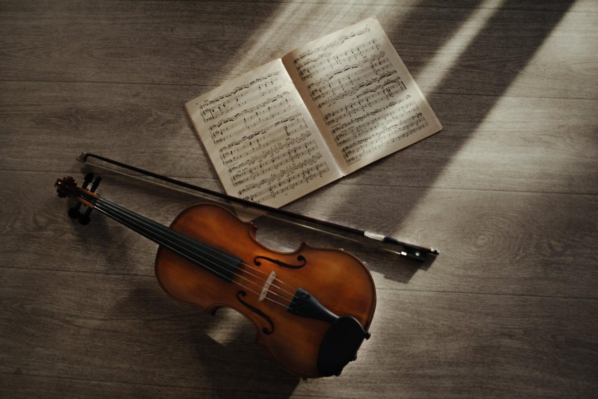 A violin with a book of music.