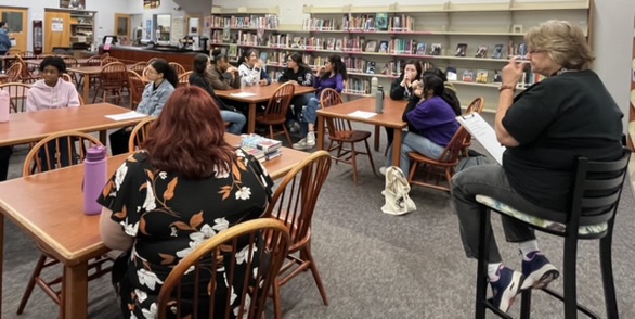 OCSA's battle of the books team playing book trivia in the media center.