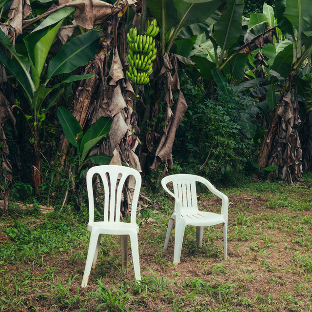 The album cover featuring two plastic chair is an ode to nostalgic Puerto Rican upbringing and culture.