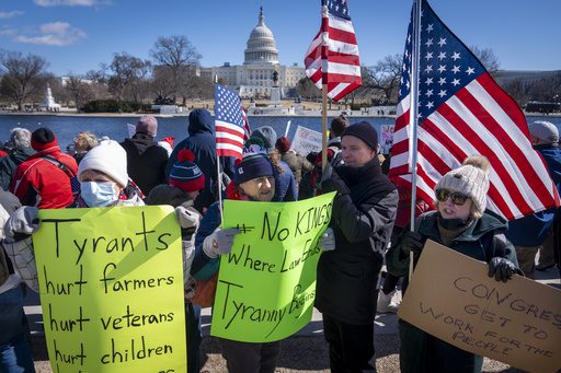 In Washington, people gather in support of federal workers and against recent actions taken by the government.