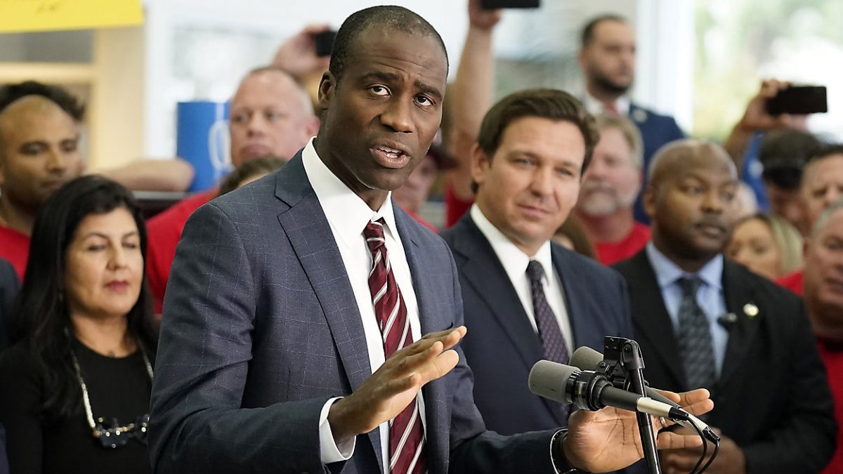 Florida's Surgeon General Dr. Joseph Ladapo speaks alongside Gov. Ron DeSantis in Brandon, Fla. 