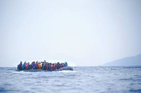 Migrants on a raft crossing the Mediterranean Sea.